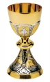 Two-tone brass chalice with bread and fishes, boat, lily, lamb.